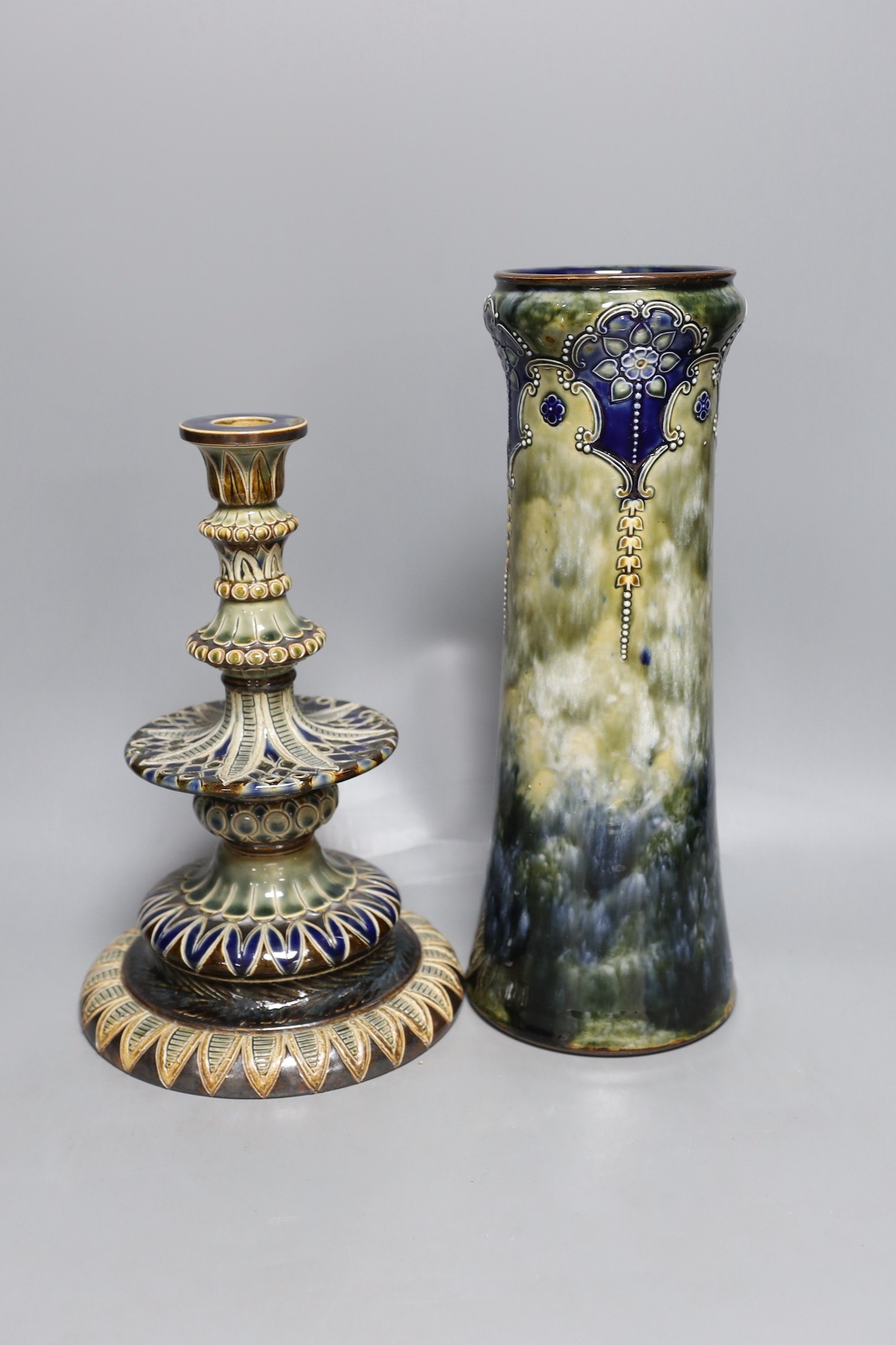 A Doulton Lambeth stoneware vase and similar candlestick by Edith D Lapton, tallest 33cm